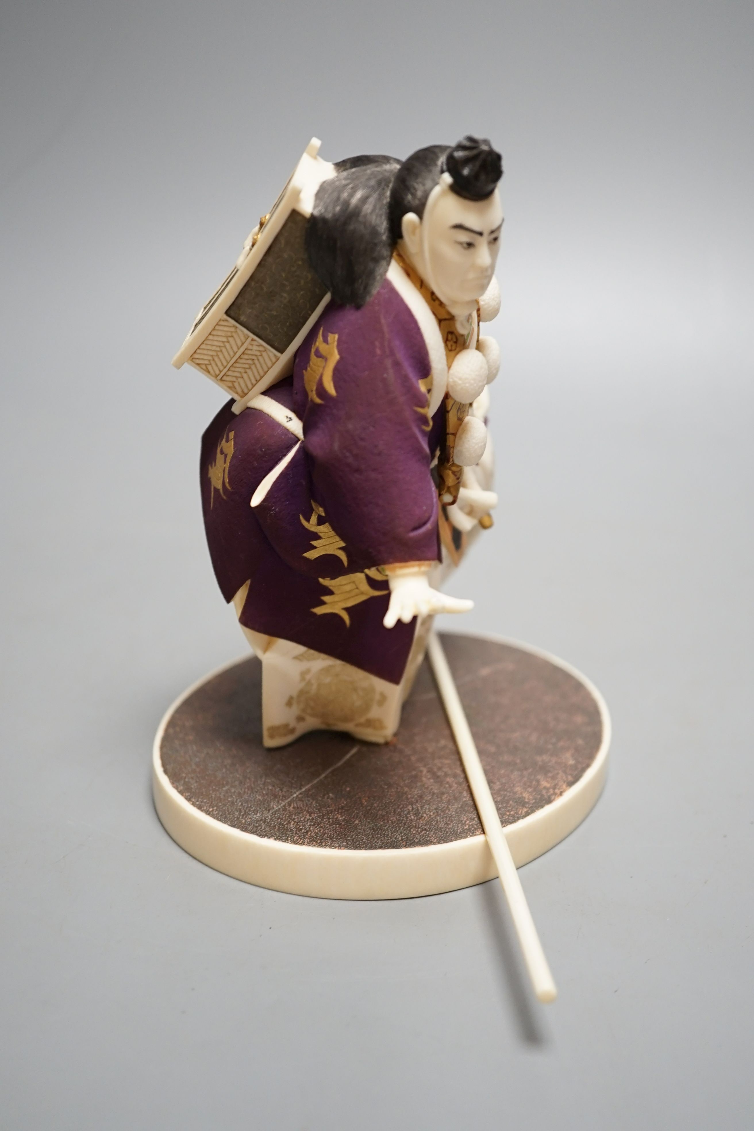 A Japanese ivory figure of a performing Yamabushi warrior monk, Taisho/early Showa period, signed to a lacquer tablet - 17cm tall